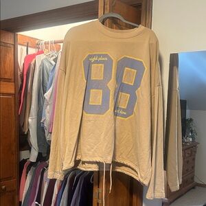 Casual Tan Sweatshirt with Blue and Yellow Accents